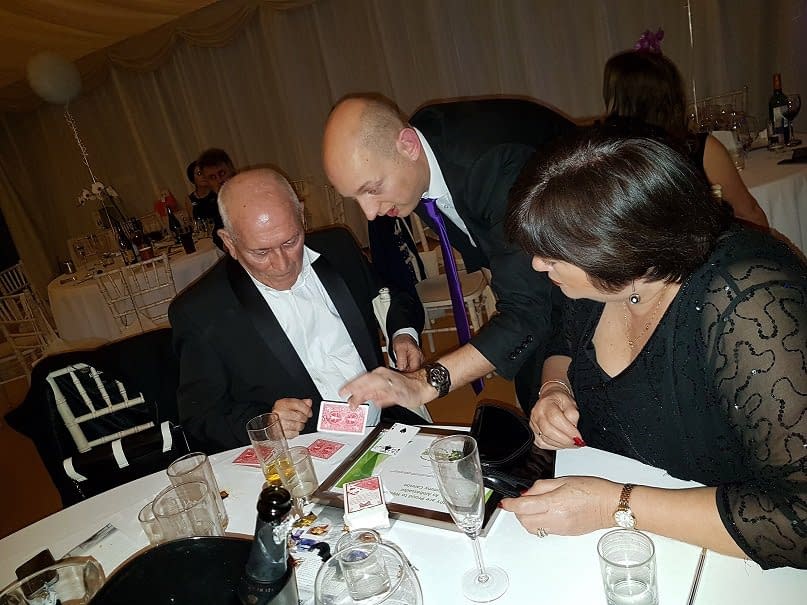 Performing At A Charity Event. Close Up Magic Performed To Comedy Legend Tommy Cannon