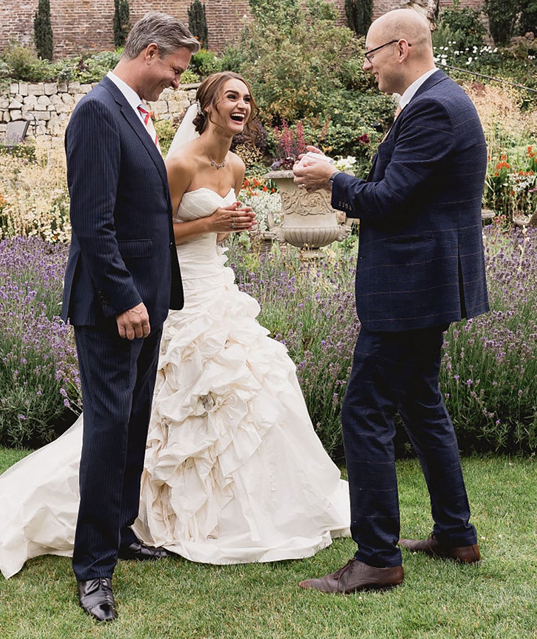 Wedding Magician In Yorkshire - Adrian Salamon Performing Close-Up Magic For A Laughing Bride In The Gardens At Gray's Court, York.