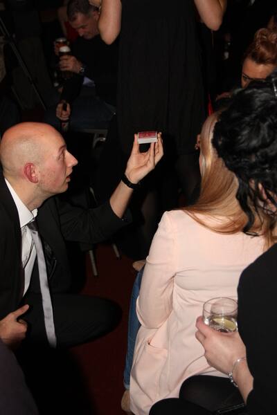 Magician In Harrogate Perorming A Close-Up Card Trick